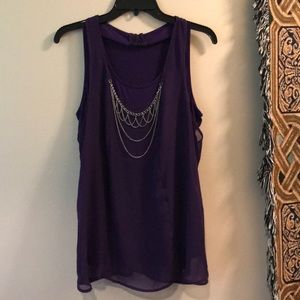 Purple sleeveless with sheer layer.